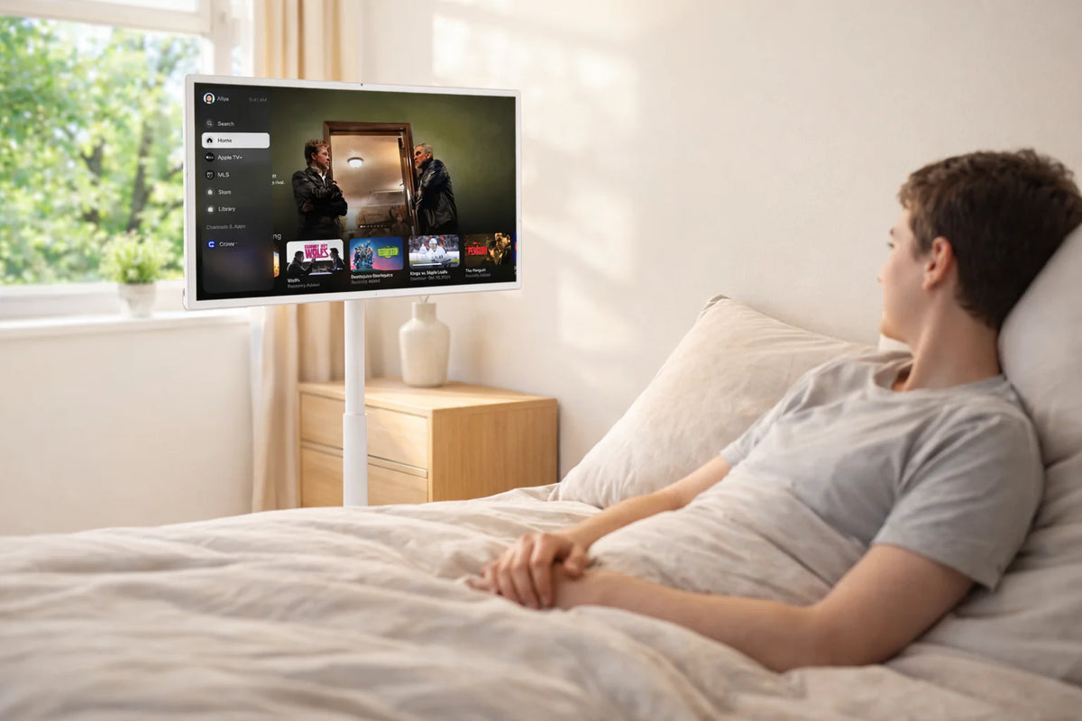 StreamSmile portable TV beside a bed